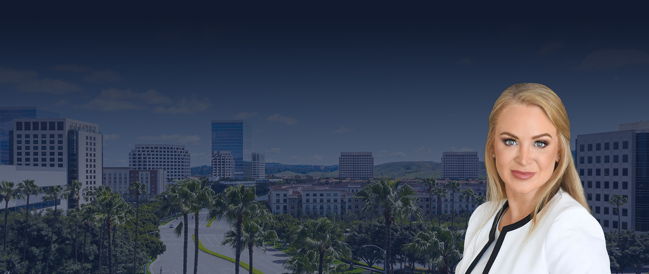 Lauren Johnson-Norris wearing a white blazer, with a cityscape and palm trees in the background.